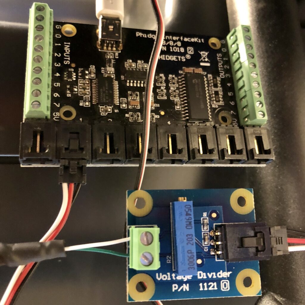 A Voltage Divider adapter connected to a PhidgetInterfaceKit board